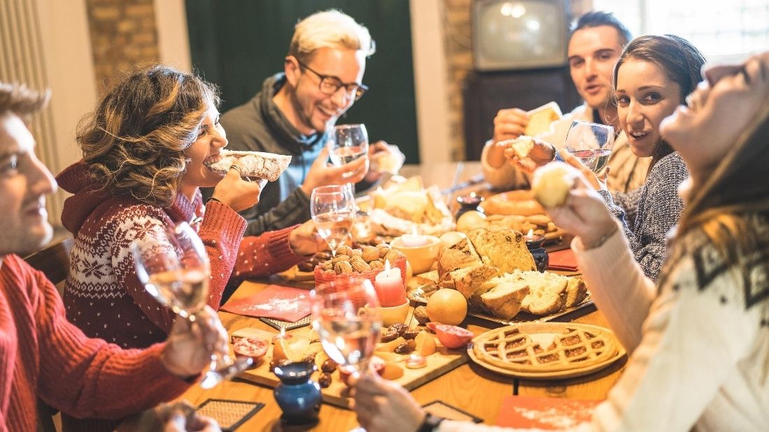 vegan community - friends eating round a table