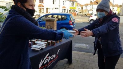 Viva! hand over food to a local food bank 