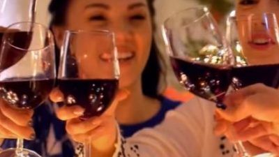people clinking glasses of wine