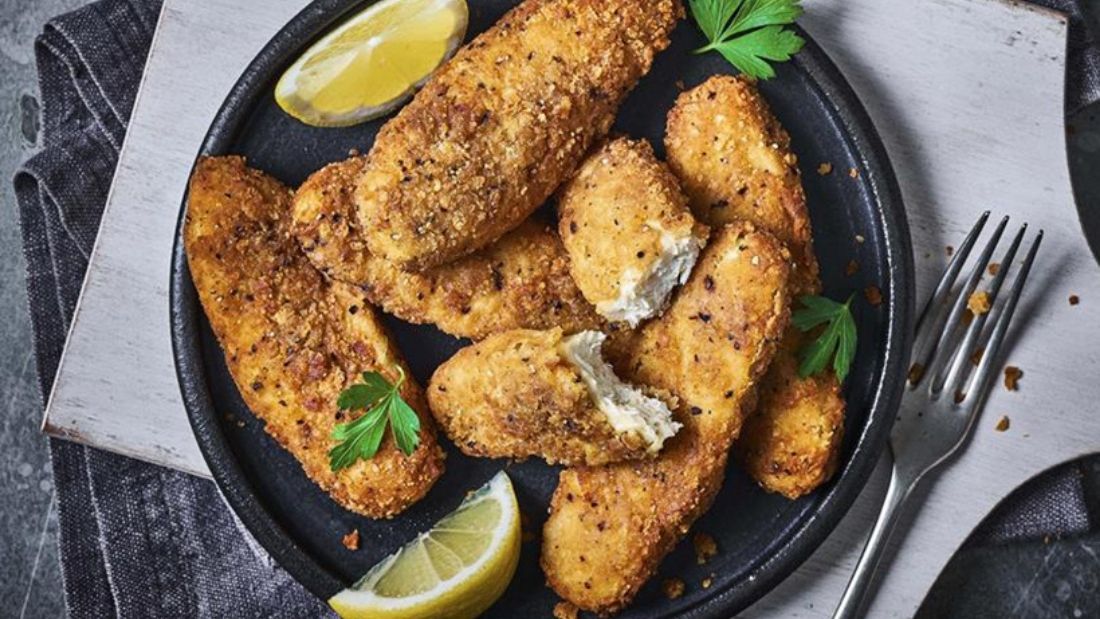 No-chicken southern fried tenders on plate with lemon slices