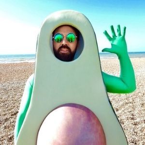 man dressed in avocado fancy dress