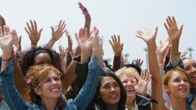 women wit hands up