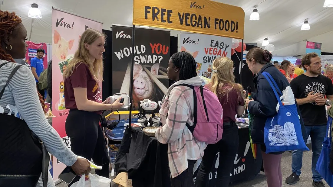 Students engage with two Viva! campaigners at Imperial freshers fayre event