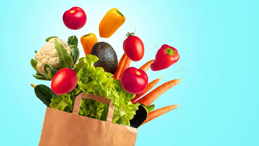 Vegetables flying out of a bag