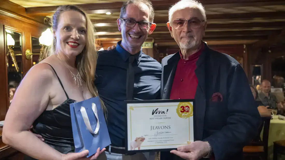 Corin and Lesley Jeavons accept Best Vegan Toffee award. With Peter Egan.