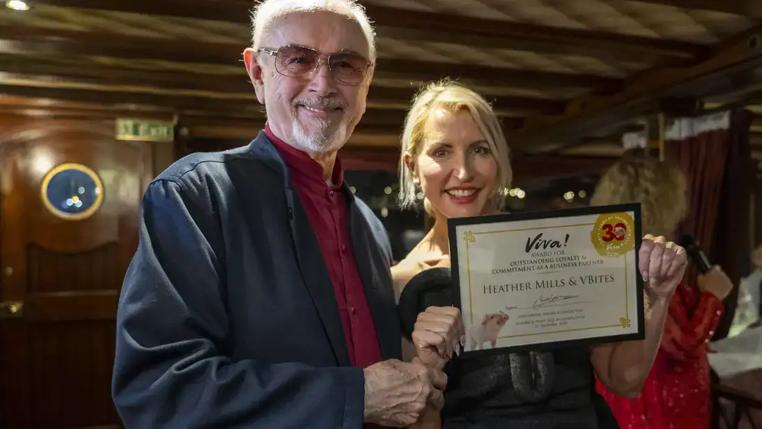 Heather Mills accepting an award. With Peter Egan.